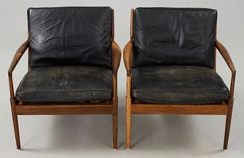 Ib Kofod-Larsen, a pair of palisander and black leather 'Samsö' armchairs, 1960's, for Thysell's, Anderslöv, Sweden.