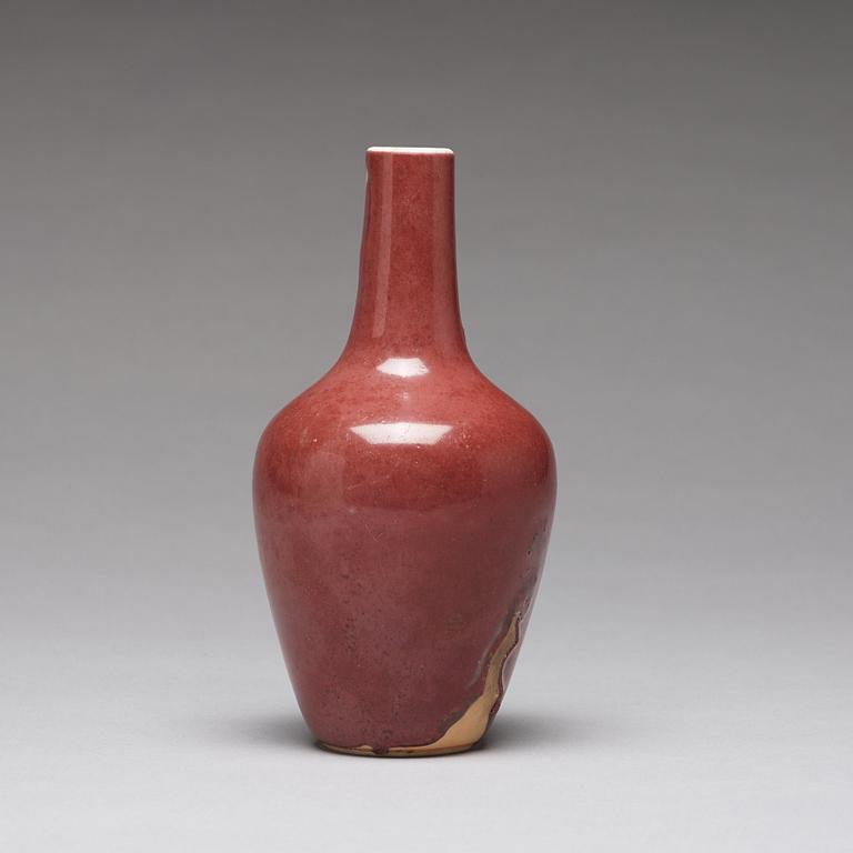 A sang de boef vase and bowl and an enamelled cup with cover and stand, Qing dynasty (1664-1912).