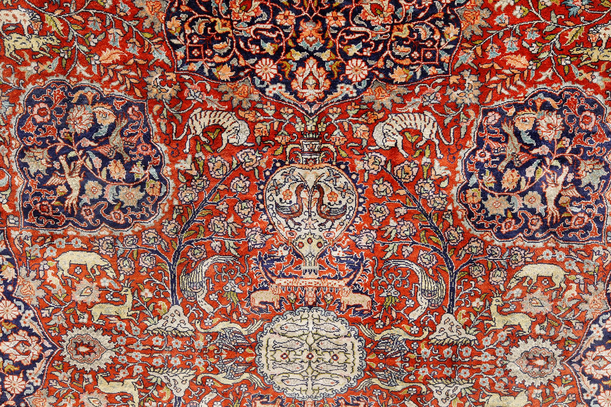 A pictoral orietal silk rug, 246 x 153 cm.