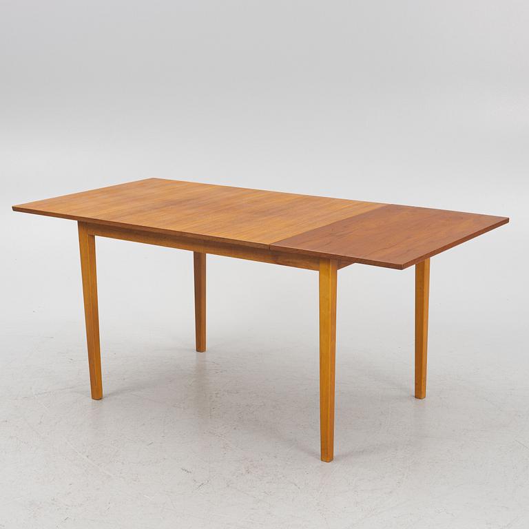 A teak-veneered dining table, 1960's/70's.