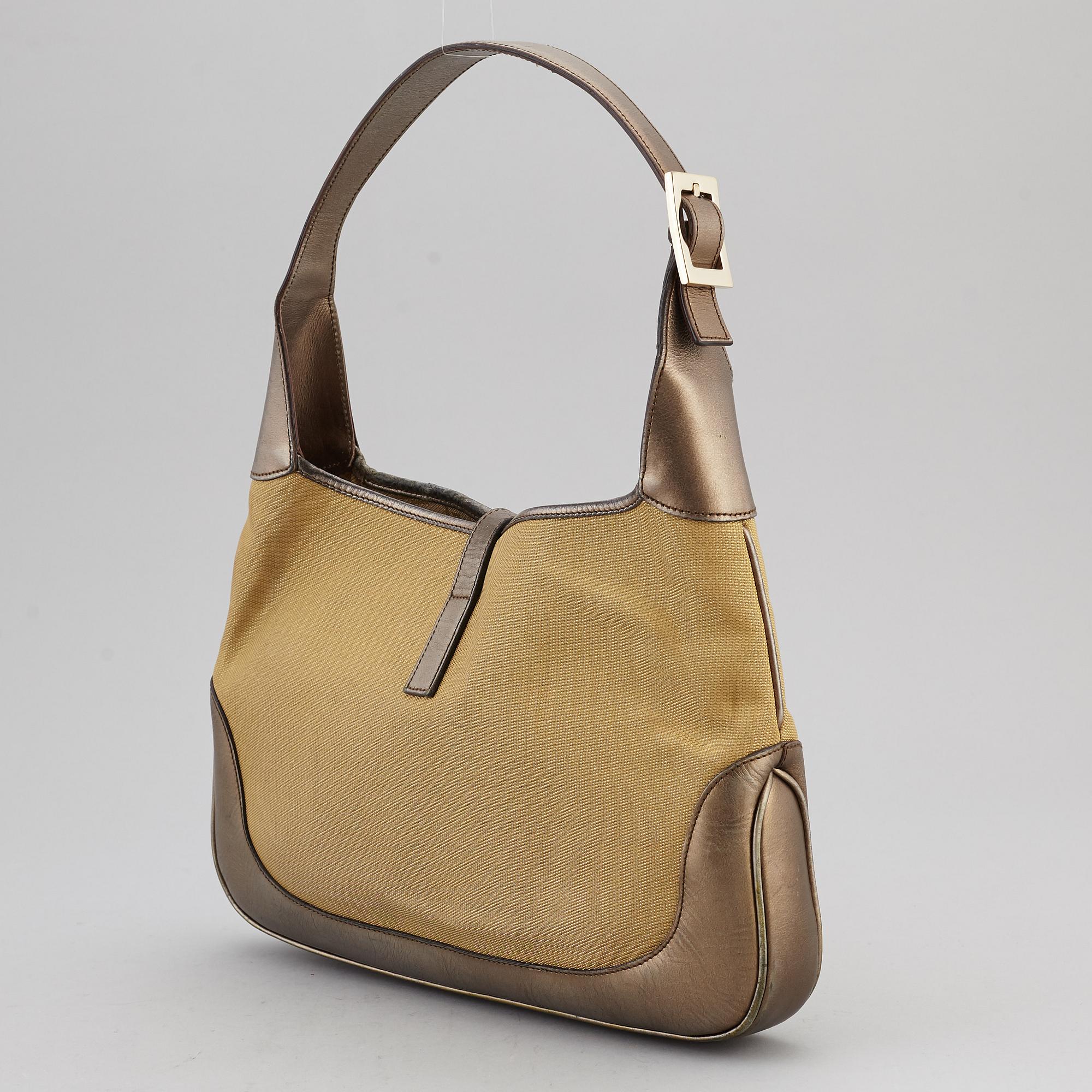 GUCCI, a metallic bag.