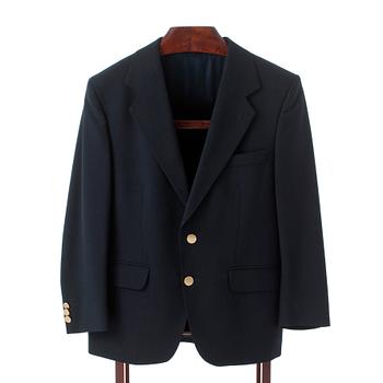 GÖTRICH, a dark blue club blazer and grey wool pants.