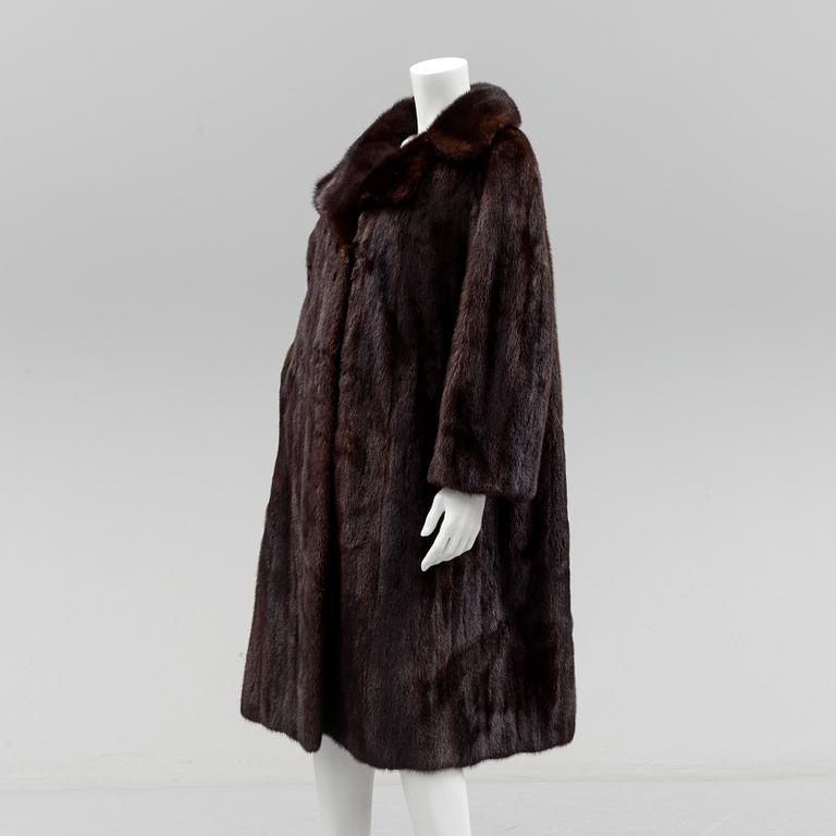 a mink coat by Johnssons Päls, Malmö, size app 40.