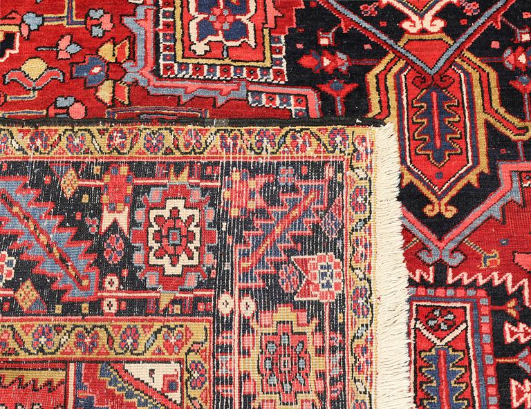A semi-antique Heris carpet, approx. 343 x 260 cm.