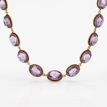 A necklace, bracelet and two brooches in gilded silver and with amethysts and pearls.