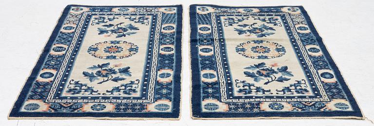A pair of Baotou rugs, China, c. 120 x 64 cm.