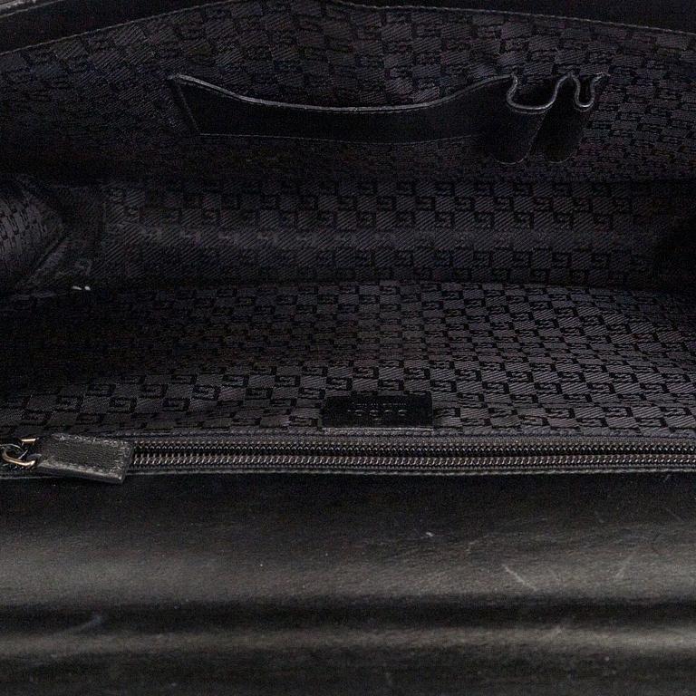 Gucci, laptop case/ bag.