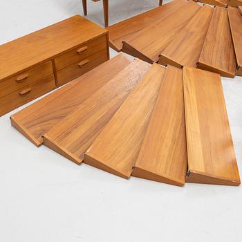 A teak and teak veneered shelf system, mid 20th century.