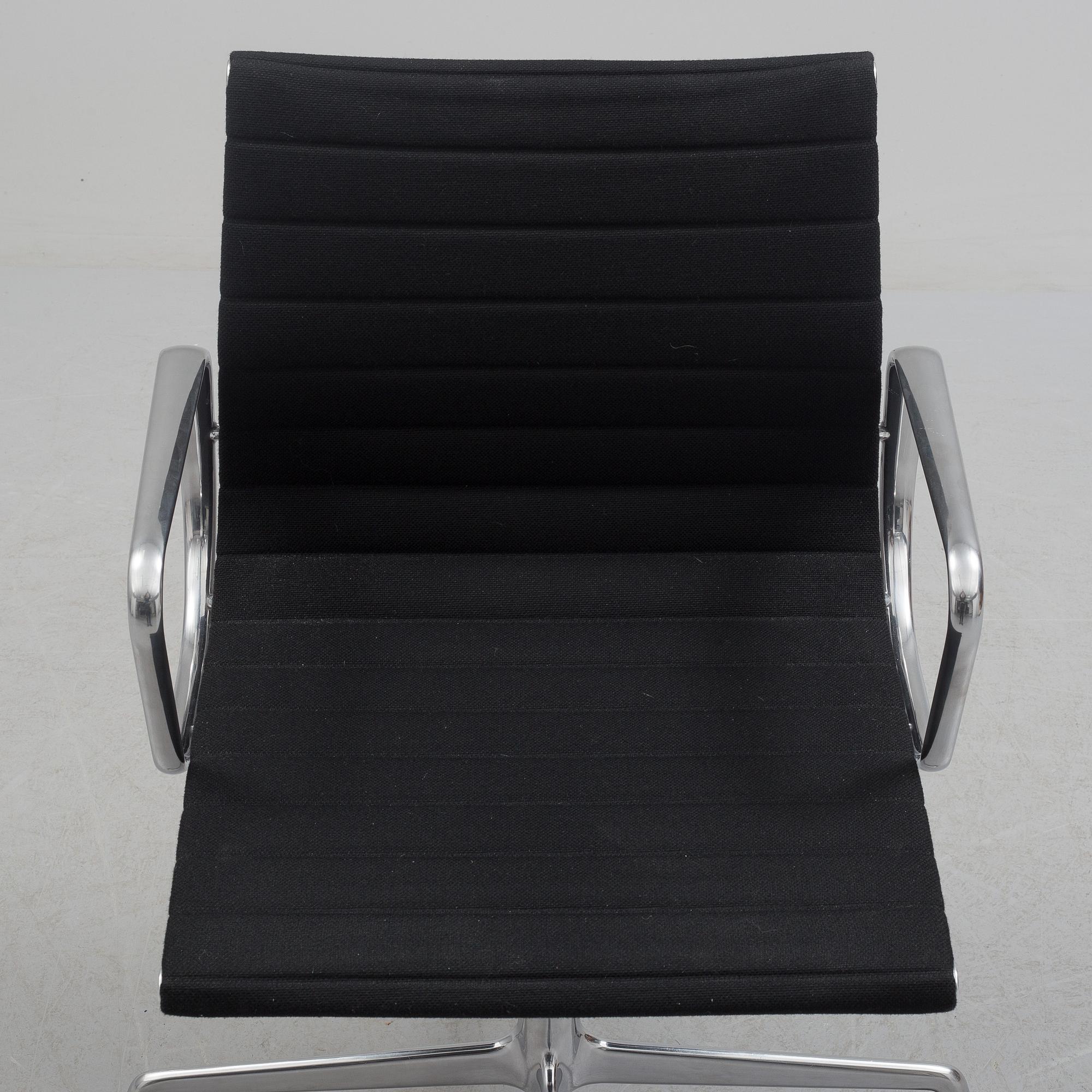 A 'EA 104 Swivel' armchair by Charles & Ray Eames, Vitra, 2016.