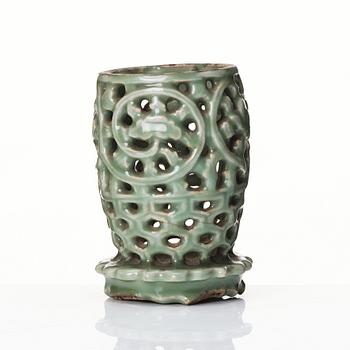 A reticulated lonquan celadon vase/candle holder, Ming dynasty (1368-1644).