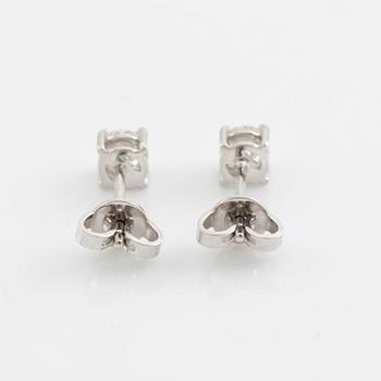 Brilliant cut diamond stud earrings.