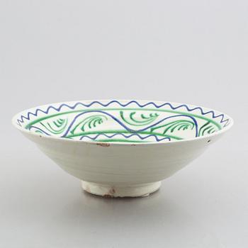 A faience bowl, circa 1900.