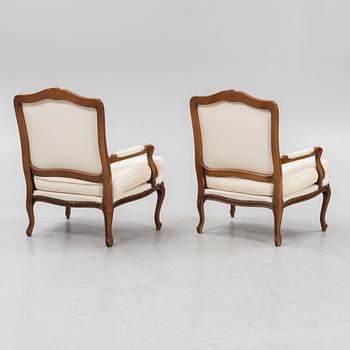 A pair of Rococo style armchairs, later part of the 20th century.
