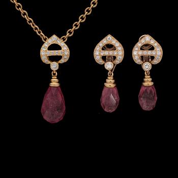 196. A C. Denevue set of earrings and pendant with turmaline, 25 cts. and brilliant cut diamonds, tot. 1.50 ct.