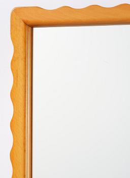 Swedish Modern, a wall mirror with wave-shaped frame, 1940s.