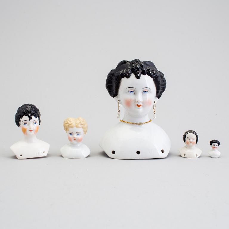 A lot of 12 dolls and doll heads in porcelain Germany early 20th century.