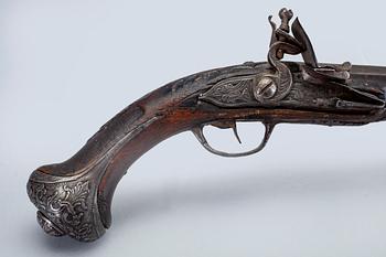 An 18th Century flinlock pistol.