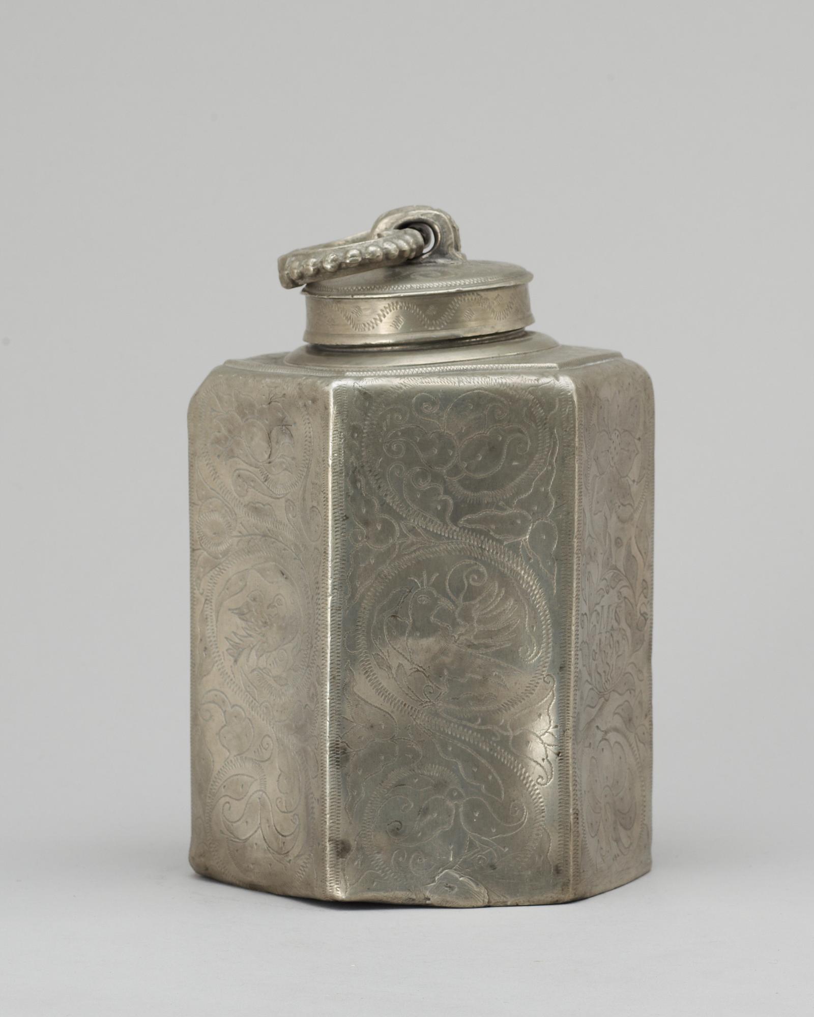 A pewter bottle. Unidentified marks.