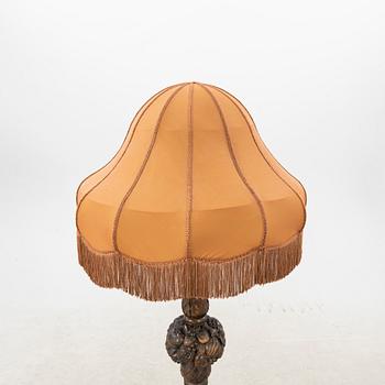 An early 1900s oak floor lamp.