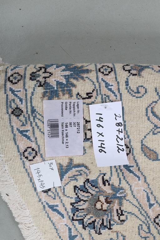 A rug, Nain, part silk, ca 146 x 146 cm.