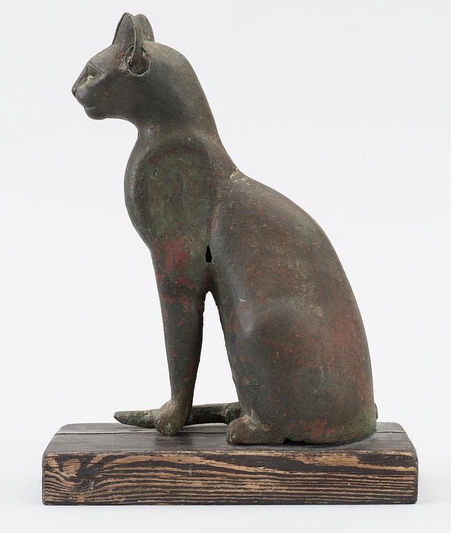 A bronze cat statuette, Egypt, possibly 22-30 Dynasty, 945-332 BC.