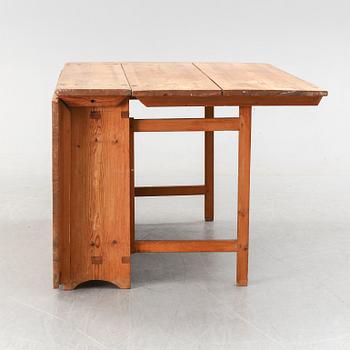 A 19th century pine gate legged table.