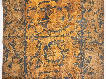 A 19th century wrought leather wallpaper, ca 388 x 97 cm.
