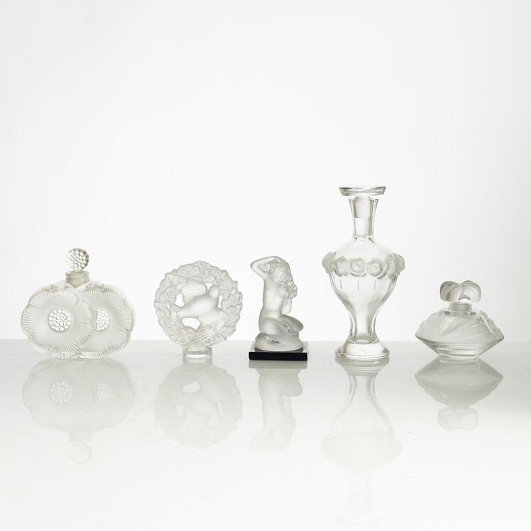 Lalique, four perfume bottles and five figurines, France, after 1945.