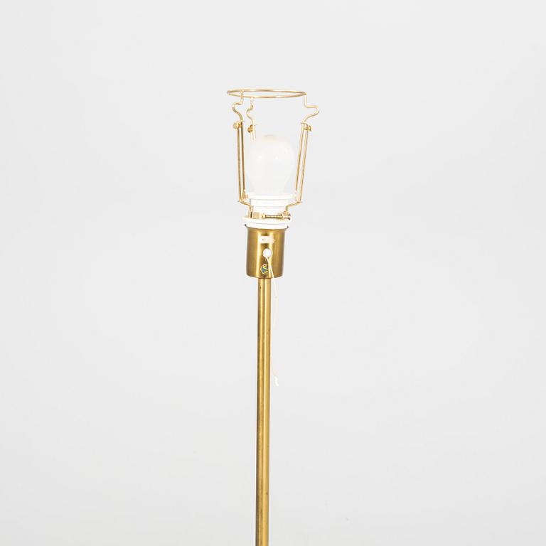 An NK 1960s brass floor lamp.