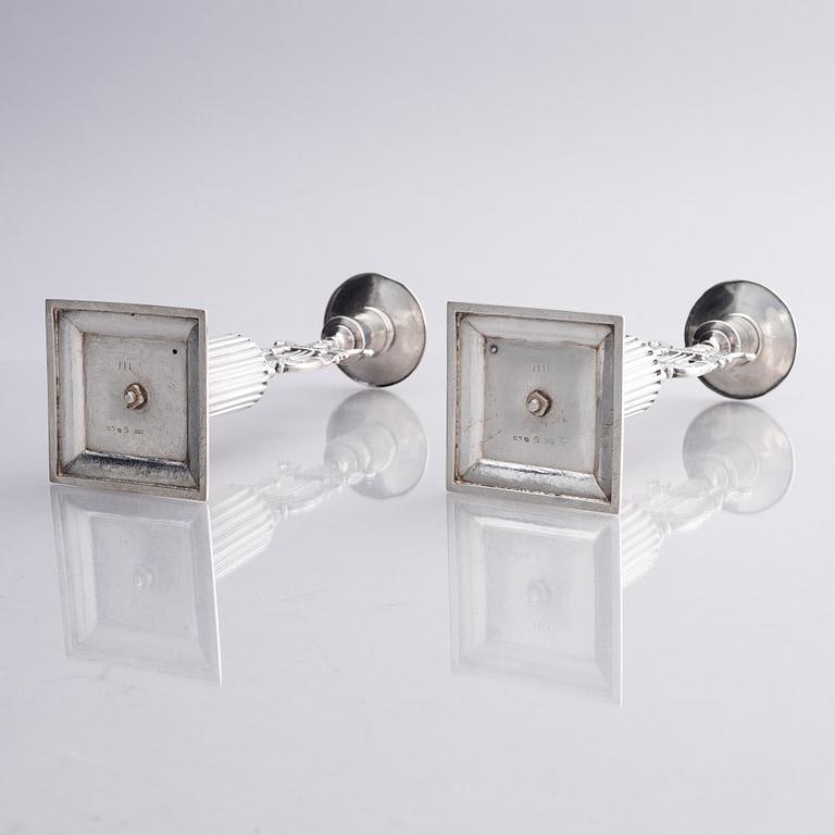 A pair of Swedish silver candlesticks, marks of Gustaf Folcker, Stockholm 1825.