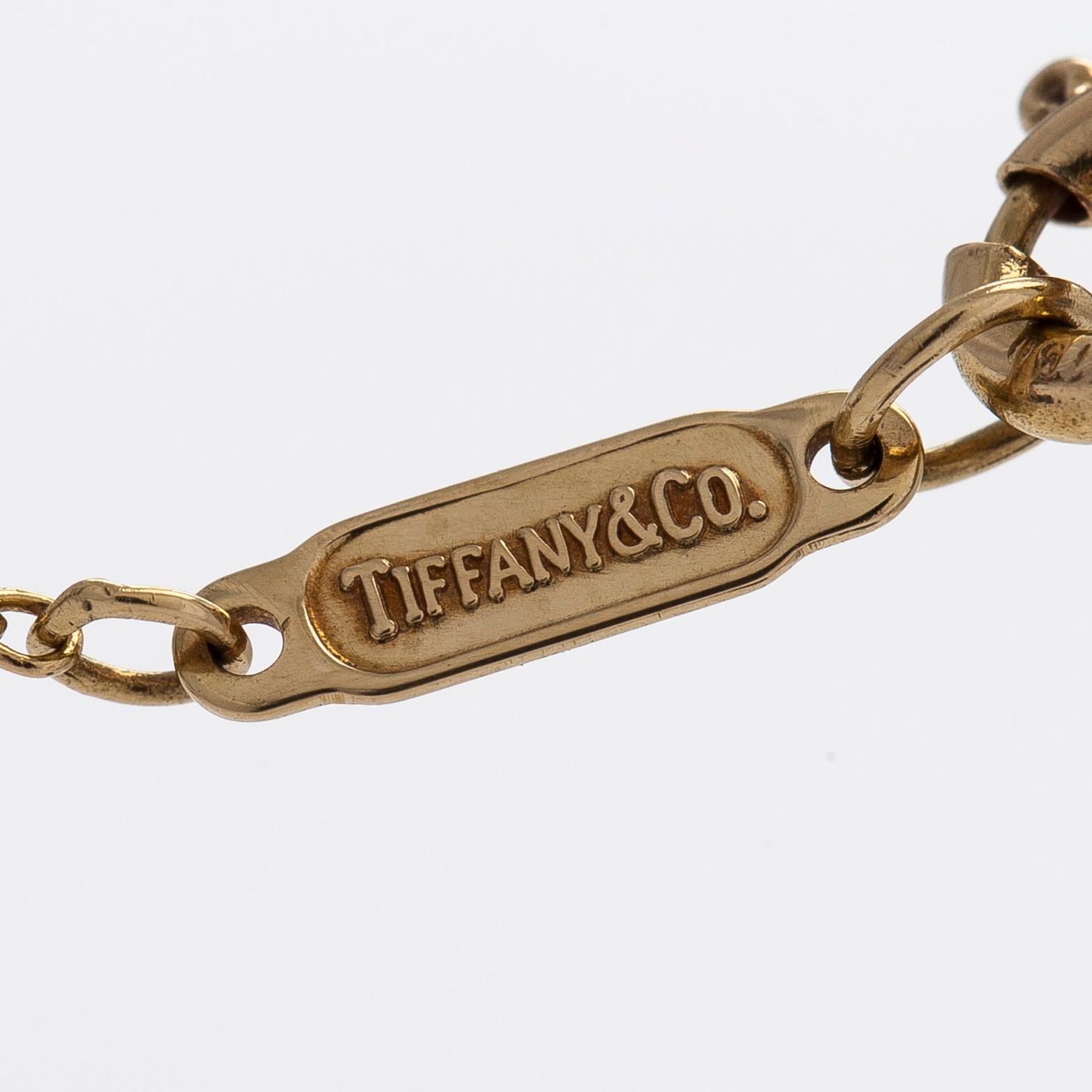 Tiffany & Co, an 18K gold necklace with diamonds.