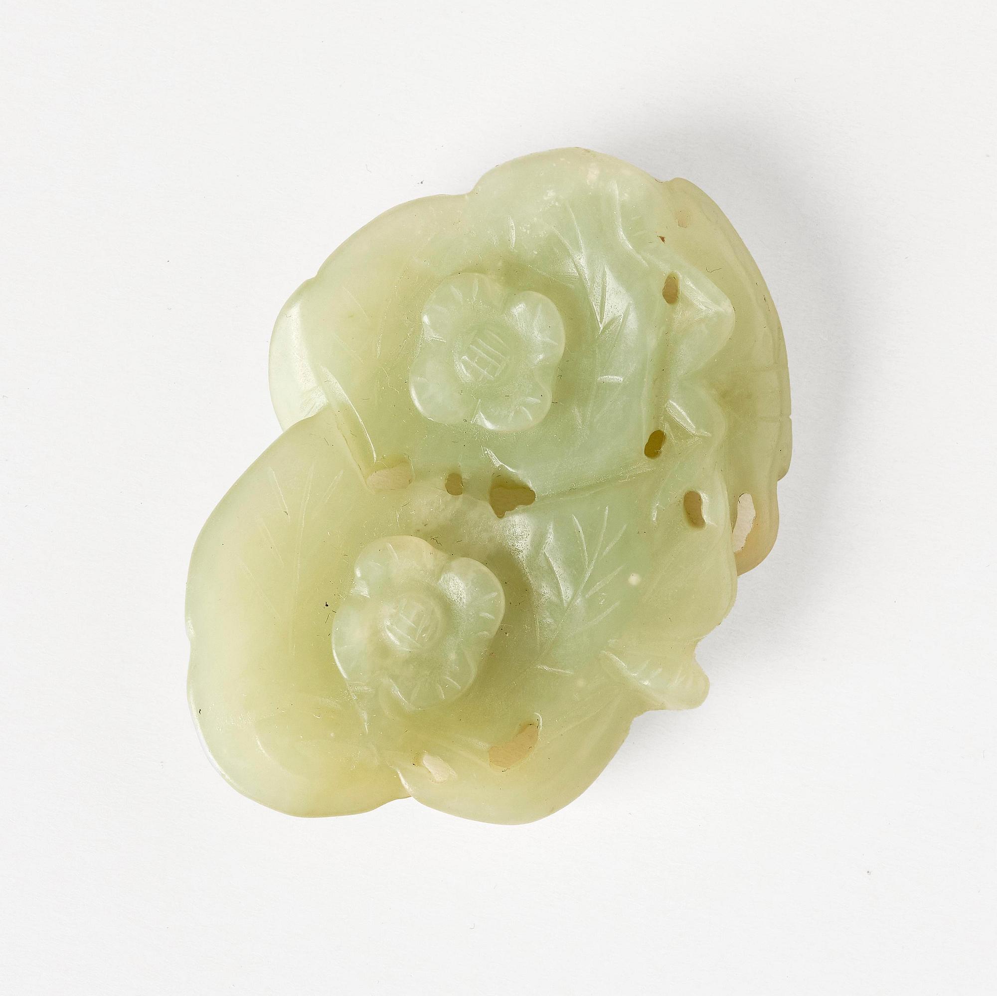 Two archers rings and two nephrite carvings.