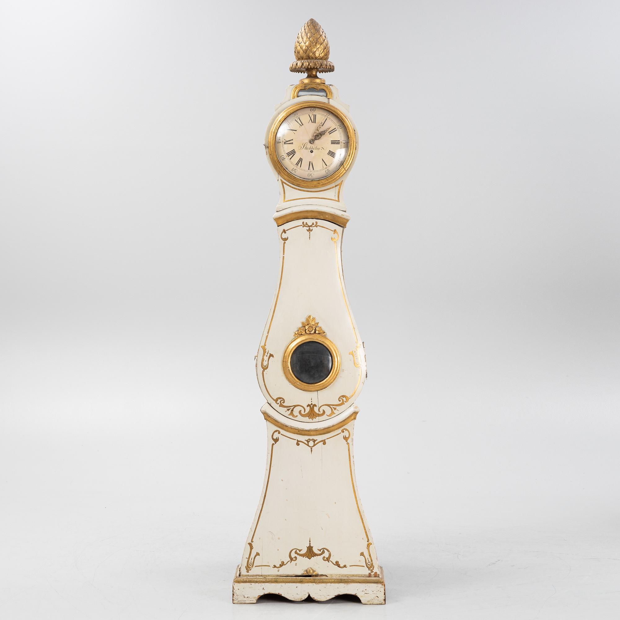 A long-case clock, 19th century.