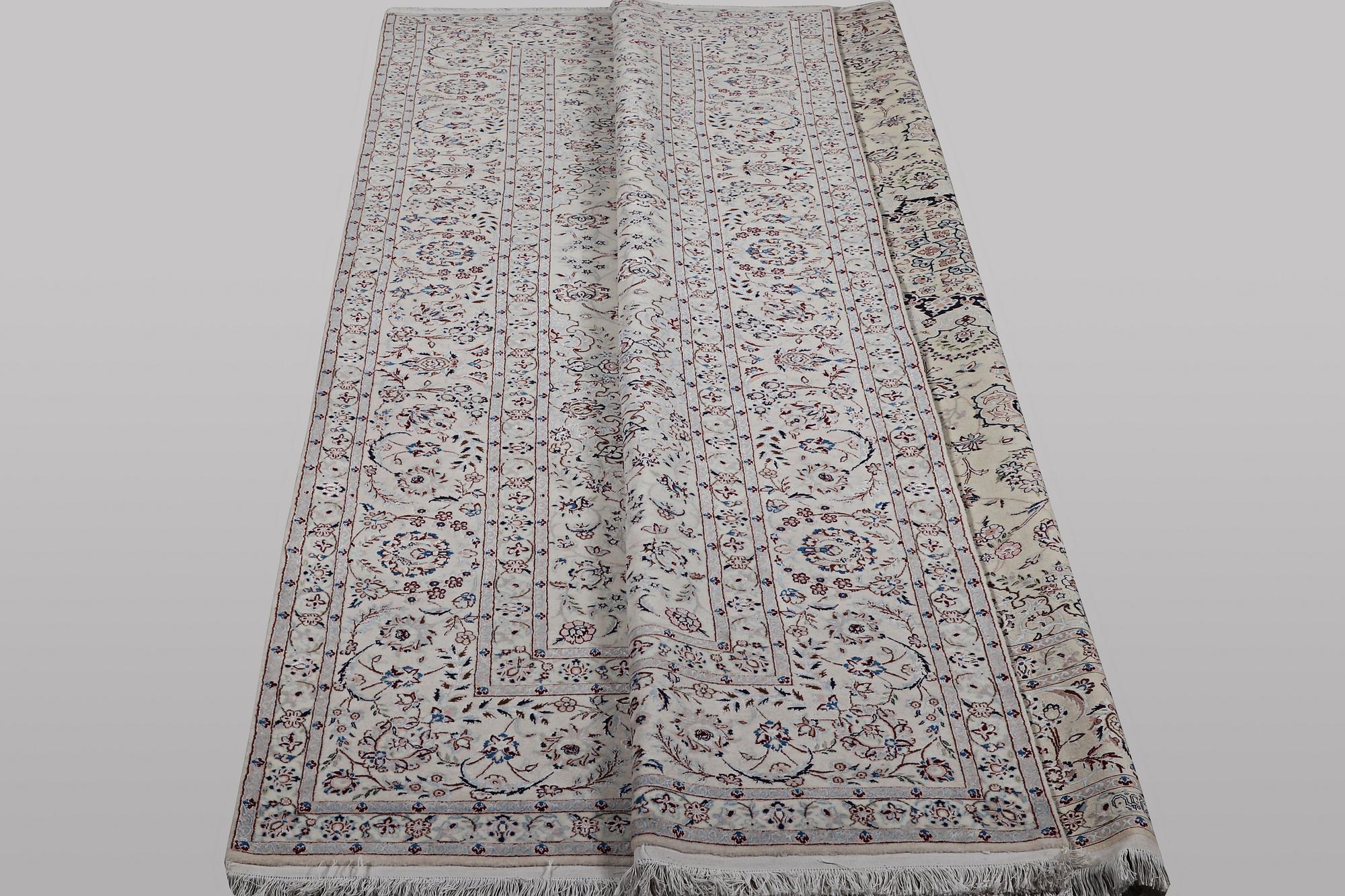 A carpet, Nain, part silk, ca 341 x 245 cm.