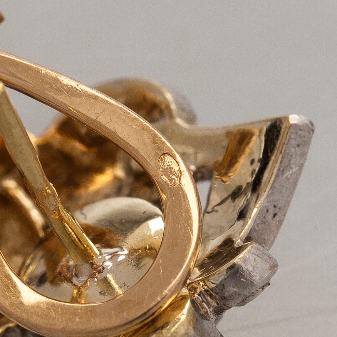 Korvakorut, 18K kultaa ja ruusuhiottuja timantteja.