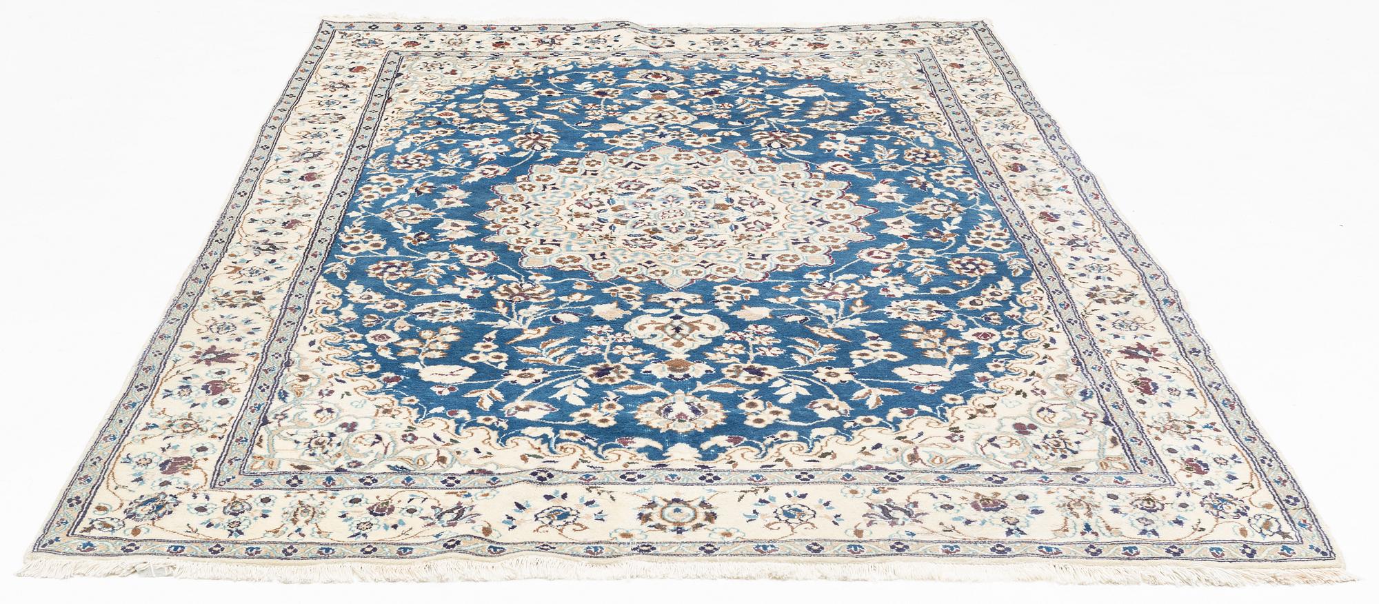 A Nain carpet, circa 310 x 196 cm.