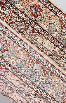 An oriental silk rug, approx. 95 x 63 cm.