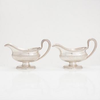 A pair of sterling silver sauce jugs, maker's mark of Andrew Fogelberg, London 1774.