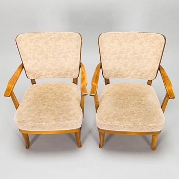 Einari Kyöstilä, a pair of 1940s open armchairs for Oy Stockmann Ab, Keravan Puusepäntehdas, Finland.