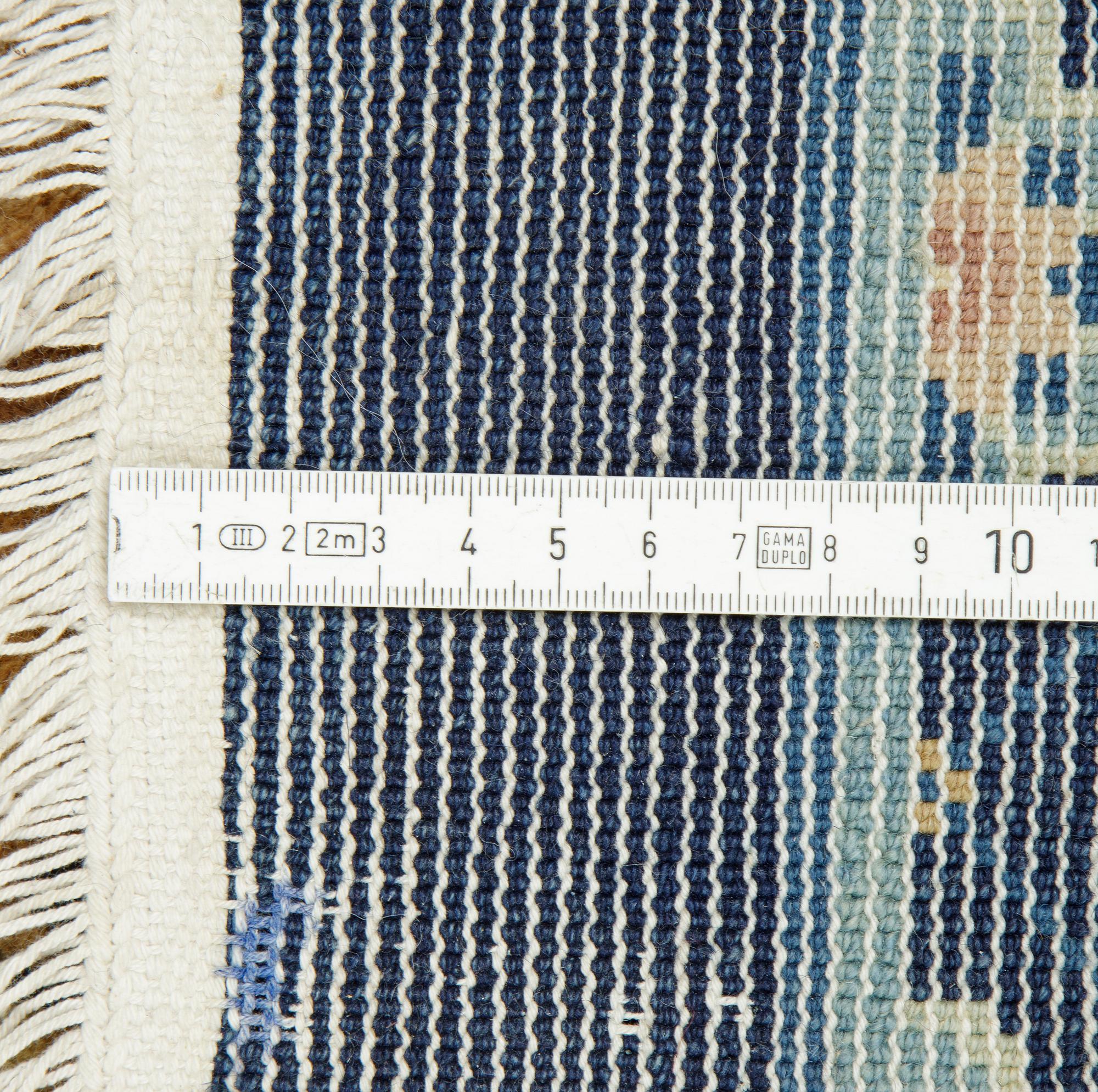 A carpet, semi-antique/Old China, ca 302 x 196 cm.