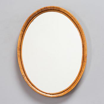 A mid-20th-century rattan wall mirror.
