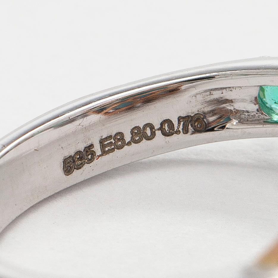 A 14K gold ring with emeralds. IGI certificate.