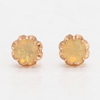 A pair of 14K gold earrings with opals.