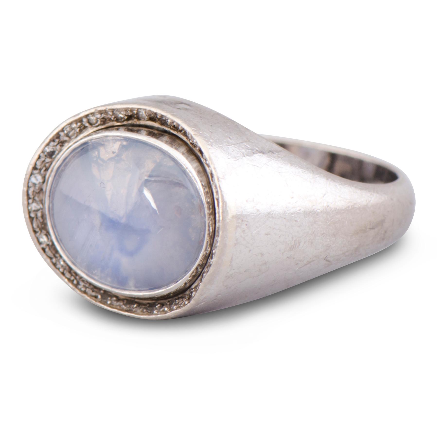 A RING, cabochon cut star sapphire, 8/8 cut diamonds, 18K white gold. A. Tillander, Helsinki Finland 1974.