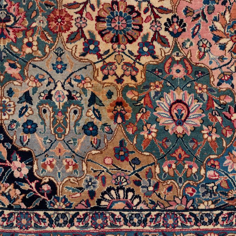 A semi-antique Kerman carpet, of Safavid 'vase' design, ca 484 x 291 cm.