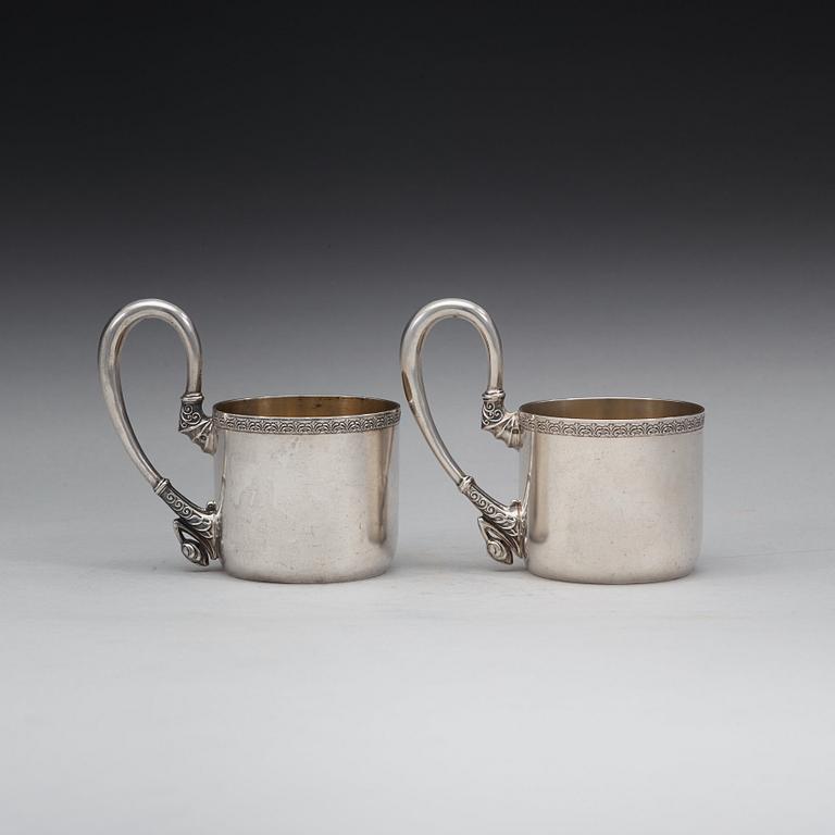 A pair of Russian 20th century parcel-gilt tea-glas holders, marks possibly of Vasily Andreyev, Moscow 1908-1917.