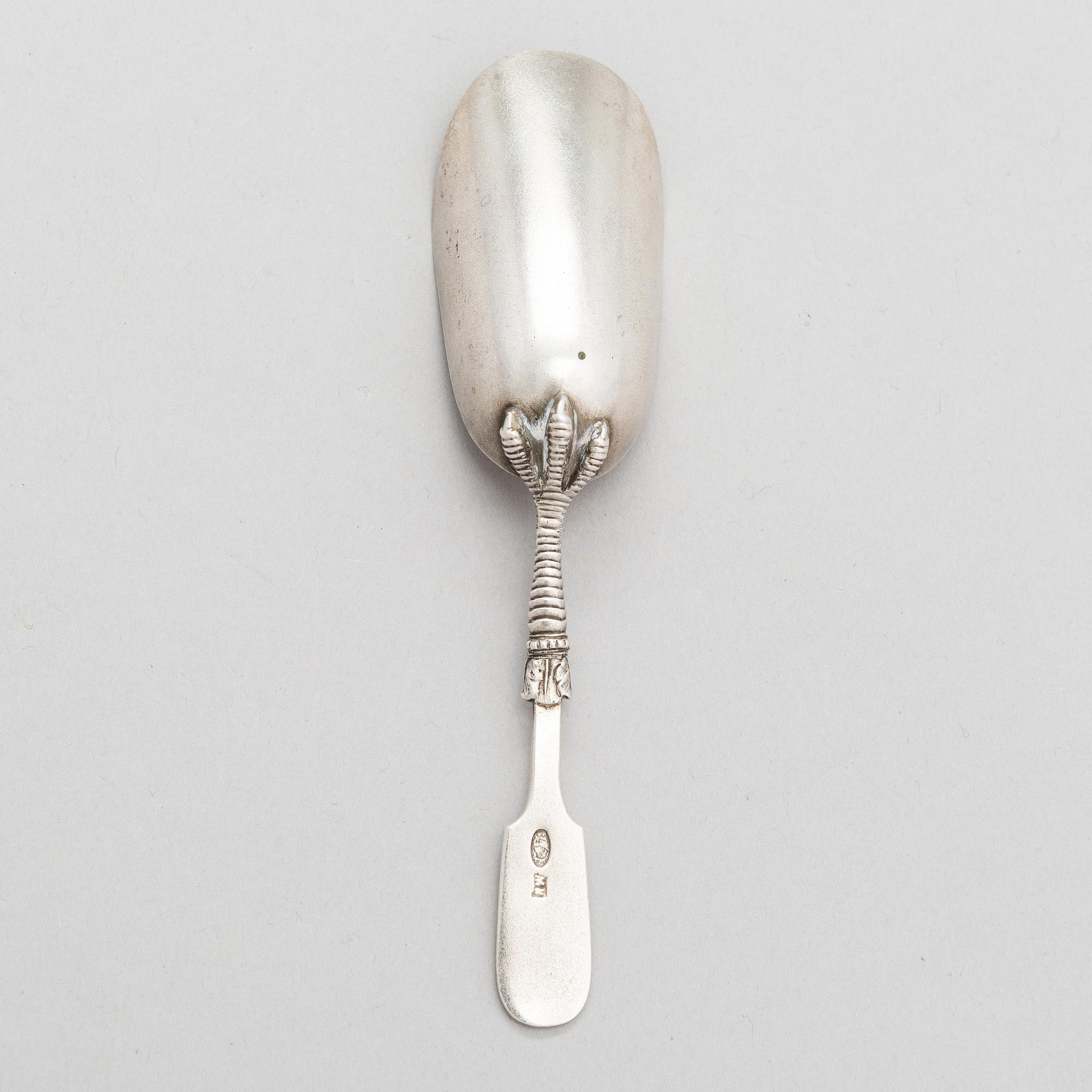 A Russian silver, parcel-gilt tea caddy spoon, Moscow from around the turn of teh century/ early 20th century.