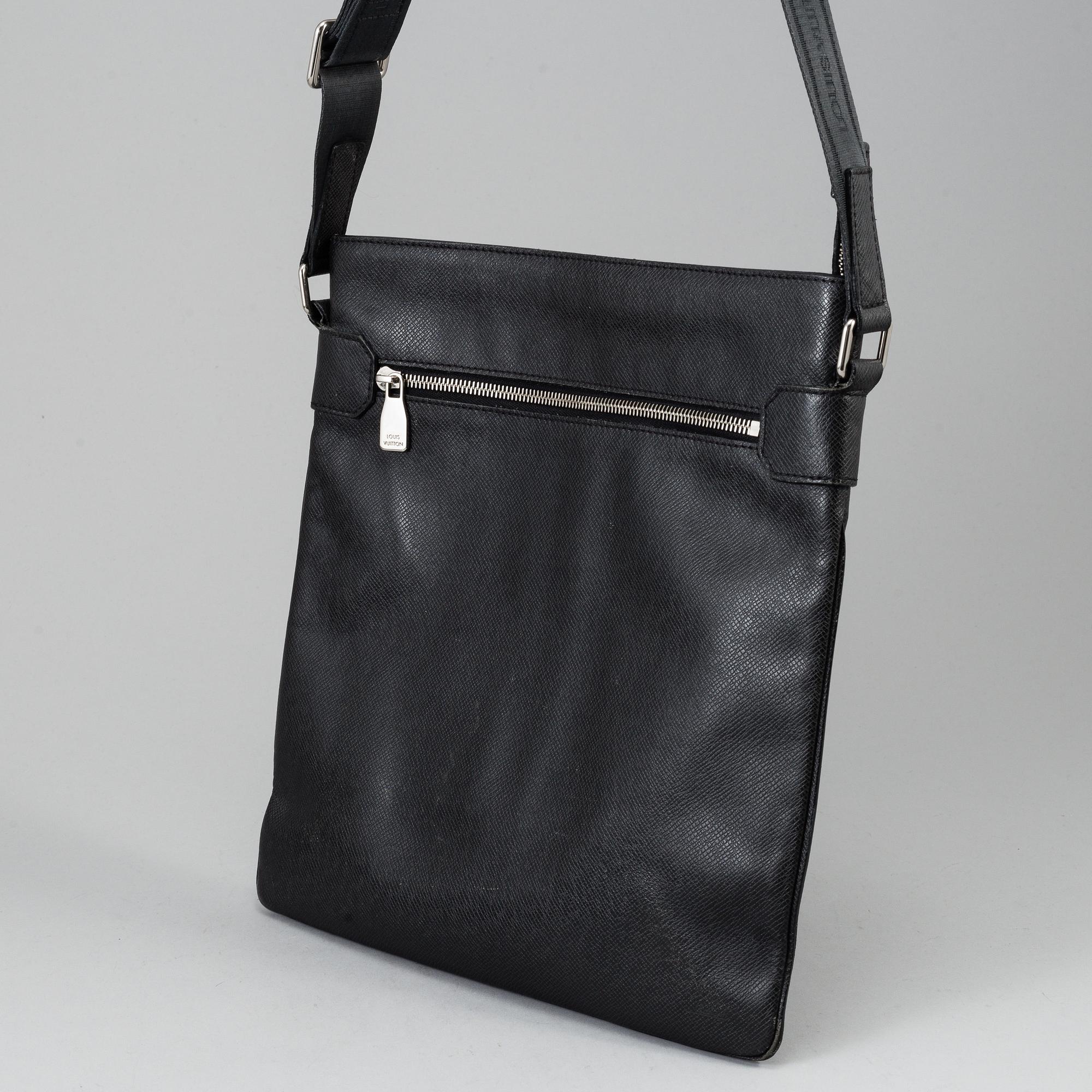 LOUIS VUITTON, a black Taiga bag, 2012.