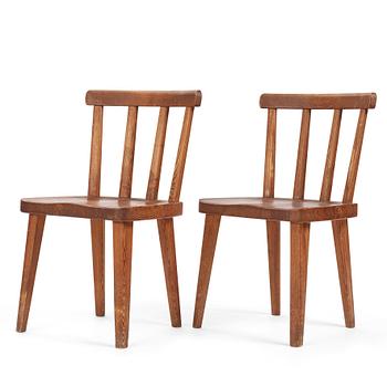 Axel Einar Hjorth, a pair of stained pine 'Utö' chairs, Nordiska Kompaniet, Sweden 1930s.