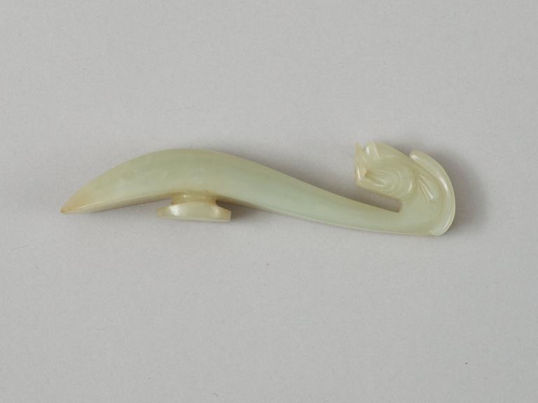 A Chinese nephrite dragon shaped belt buckle.
